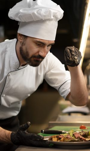 chef-cooking-kitchen-while-wearing-professional-attire
